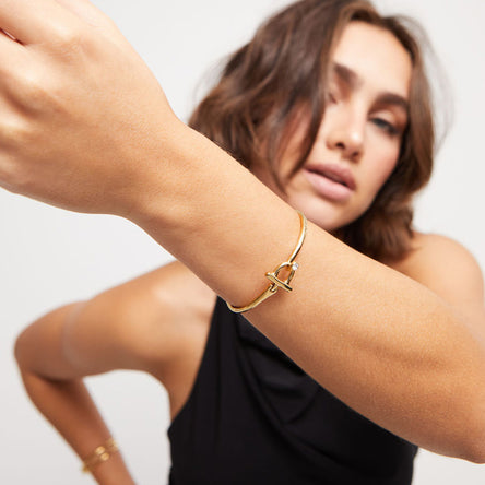 Uno de 50 Gold Plated Bangle bracelet with white topaz